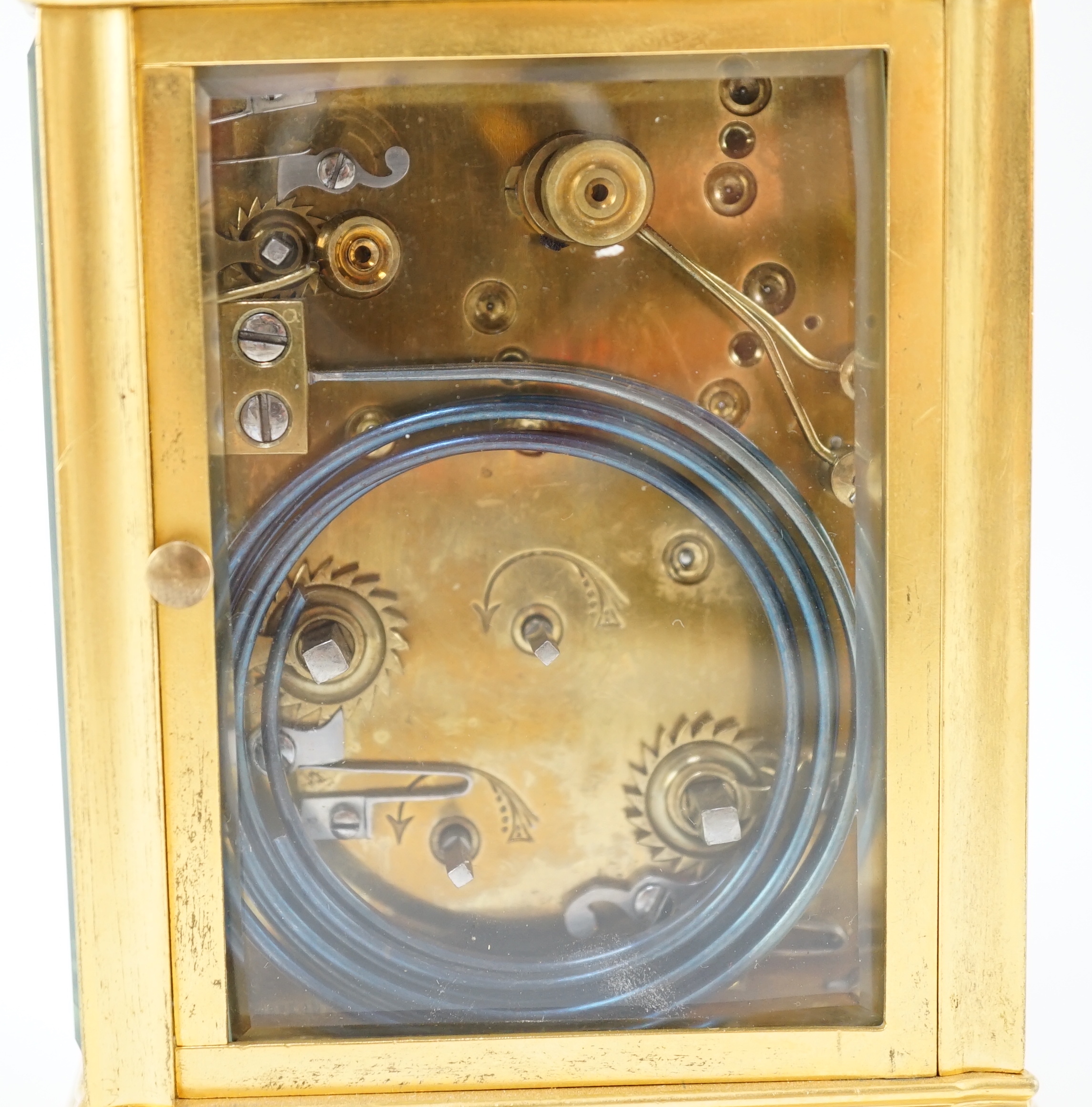 An early 20th century French ormolu Grande Sonnerie alarum clock, with enamelled Arabic dials and gorge case, movement striking on two blued steel gongs, 10cm wide, 9cm deep, 15.5cm high
